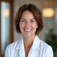 Portrait of Dr. Evelyn Reed, representing an Austin healthcare partner, in a professional medical setting.