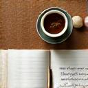 Ceramic tea cup and journal on a wooden desk, symbolizing personal assessment