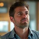 Portrait of Michael, a tech director, looking focused and calm