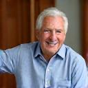 Robert, a man in his 50s, smiling, showcasing improved posture